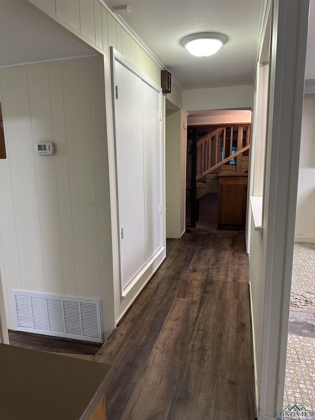 hall with dark hardwood / wood-style flooring