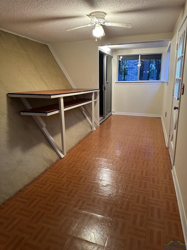 hallway featuring dark parquet floors and a textured ceiling