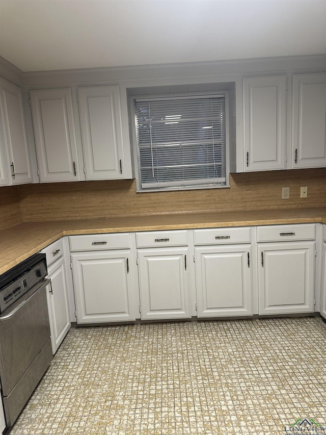 kitchen with white cabinetry, decorative backsplash, and dishwasher