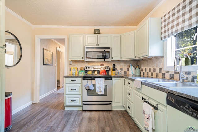 kitchen featuring sink, crown molding, appliances with stainless steel finishes, backsplash, and dark hardwood / wood-style flooring