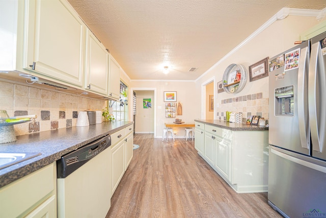 kitchen with light hardwood / wood-style flooring, stainless steel fridge, ornamental molding, and dishwasher