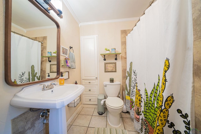 bathroom featuring crown molding, tile patterned floors, and toilet