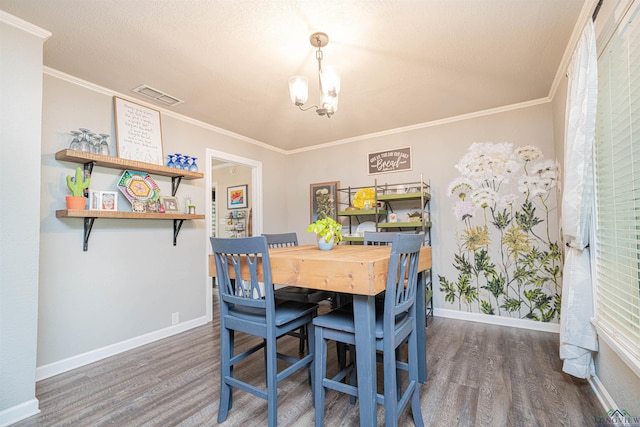 dining room featuring crown molding and dark hardwood / wood-style flooring