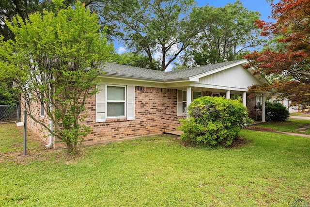 ranch-style home with brick siding and a shingled roof