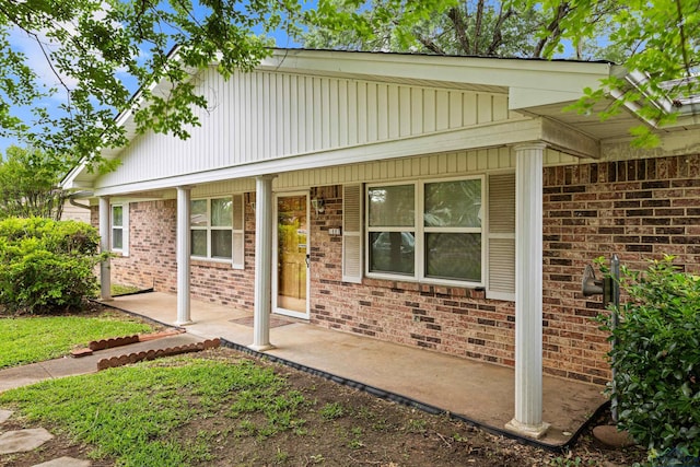 view of front of home featuring brick siding