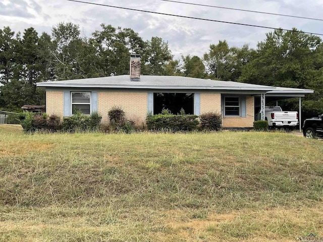 view of front of property featuring a carport