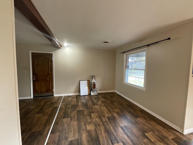 spare room featuring dark hardwood / wood-style flooring