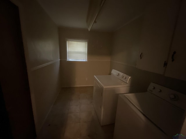 402 Mark Dr, Marshall, TX 75672 - clothes washing area featuring cabinets and washing machine and clothes dryer
