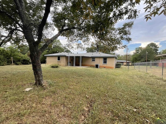402 Mark Dr, Marshall, TX 75672 - rear view of house featuring a yard