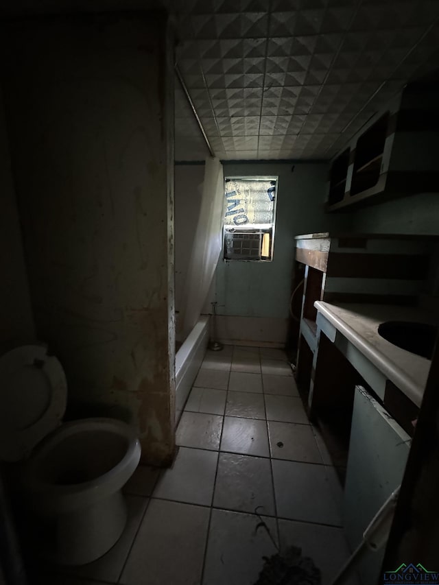 bathroom with tile patterned flooring, vanity, cooling unit, and toilet