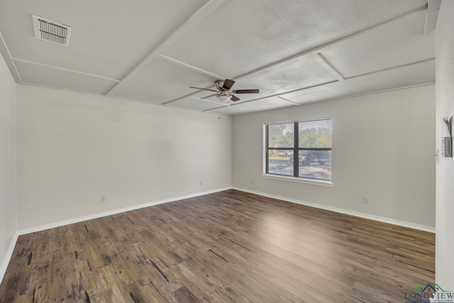 spare room with ceiling fan and dark hardwood / wood-style floors