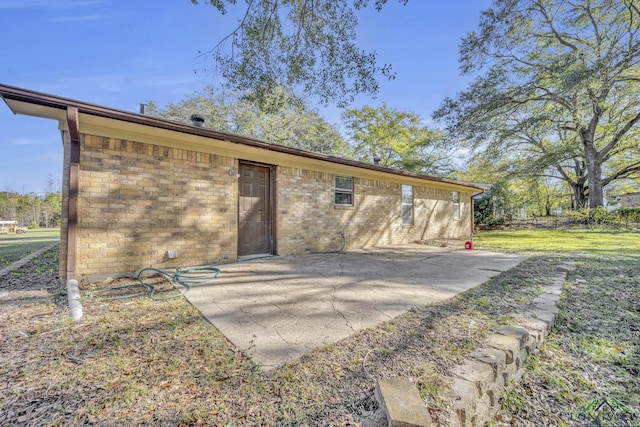 back of house with a patio area