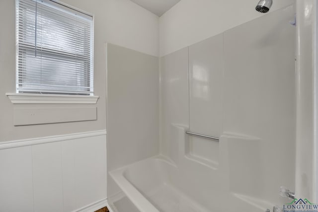 bathroom featuring shower / washtub combination and plenty of natural light