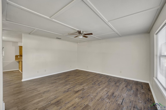 spare room featuring ceiling fan and dark hardwood / wood-style flooring