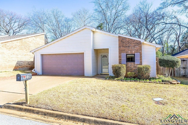 mid-century inspired home with fence, concrete driveway, a front yard, a garage, and brick siding