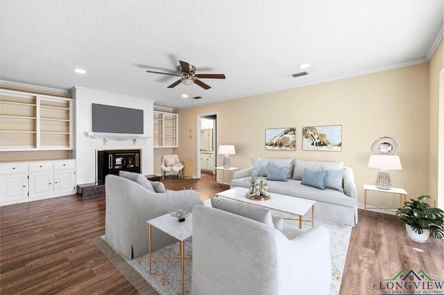 dining area featuring dark hardwood / wood-style flooring, ceiling fan with notable chandelier, and a textured ceiling