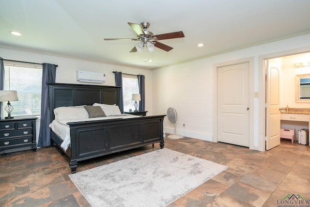 901 N Whatley Rd, White, TX 75693 - bedroom with a wall mounted air conditioner, stone finish floors, ensuite bathroom, ceiling fan, and baseboards
