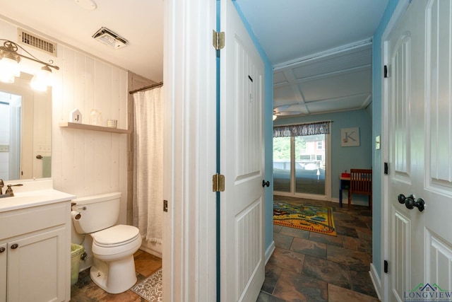 901 N Whatley Rd, White, TX 75693 - full bathroom with vanity, toilet, stone finish flooring, a ceiling fan, and curtained shower