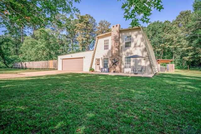 901 N Whatley Rd, White, TX 75693 - view of front of house featuring a chimney, concrete driveway, and an attached garage