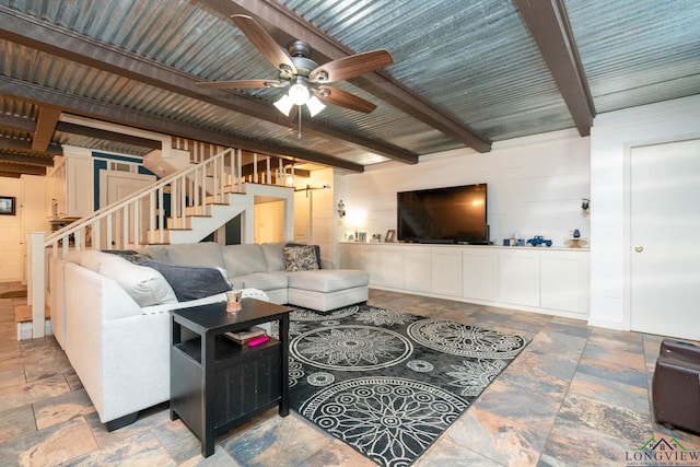 901 N Whatley Rd, White, TX 75693 - living area with stone tile floors, stairway, a ceiling fan, and beam ceiling