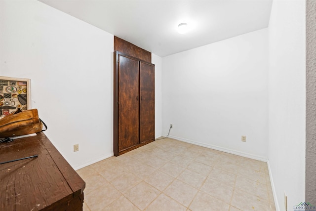 bedroom featuring baseboards