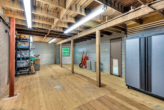 basement with wood-type flooring