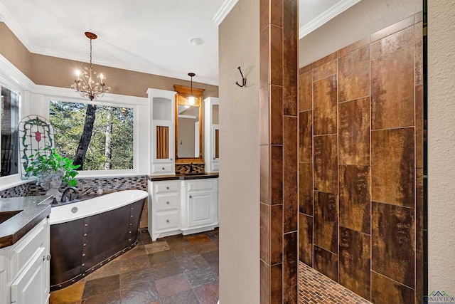 bathroom with a chandelier, crown molding, vanity, and independent shower and bath