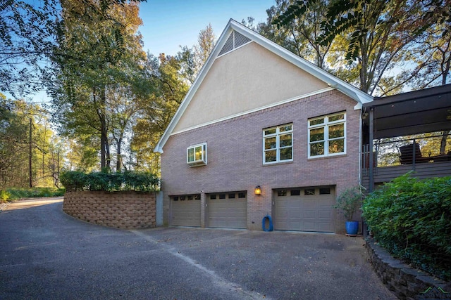 view of side of property with a garage