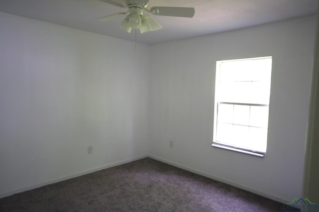 carpeted spare room with ceiling fan and a healthy amount of sunlight