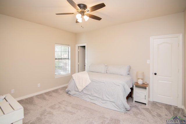 bedroom with light colored carpet and ceiling fan