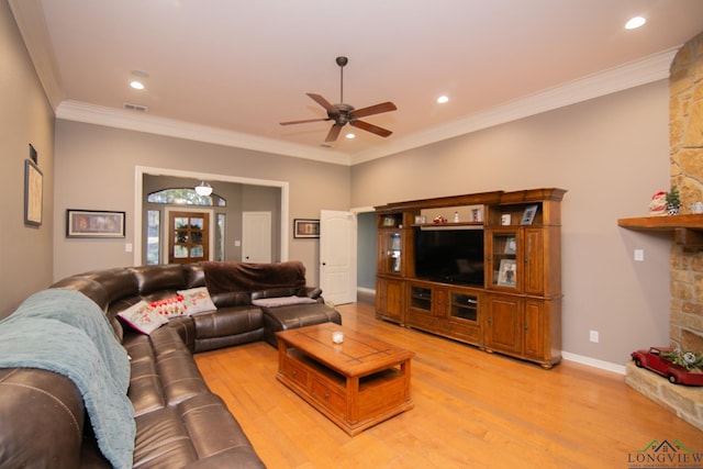 living room with hardwood / wood-style floors, ceiling fan, and ornamental molding