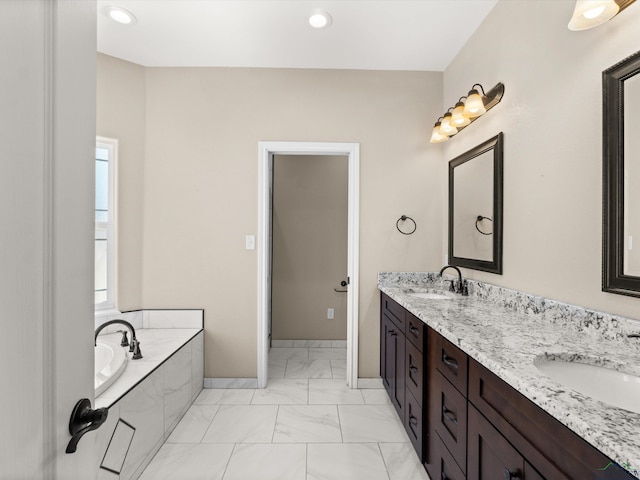 bathroom featuring vanity and a tub