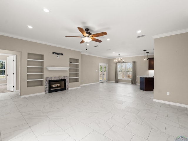 unfurnished living room featuring ceiling fan with notable chandelier, ornamental molding, and built in shelves