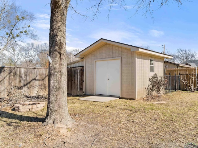 view of outbuilding with a lawn