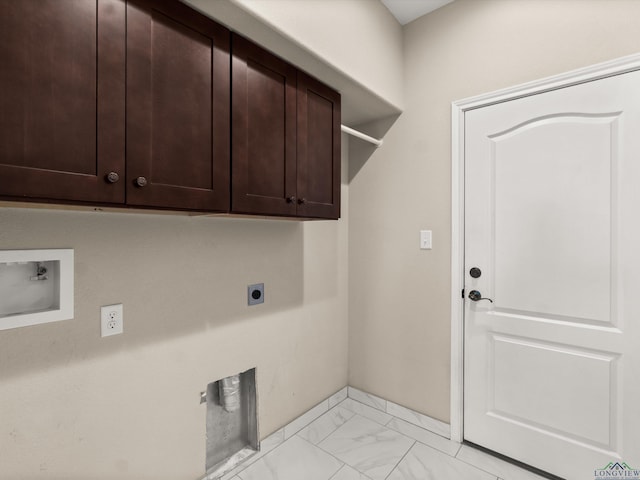 laundry area featuring electric dryer hookup, hookup for a washing machine, and cabinets