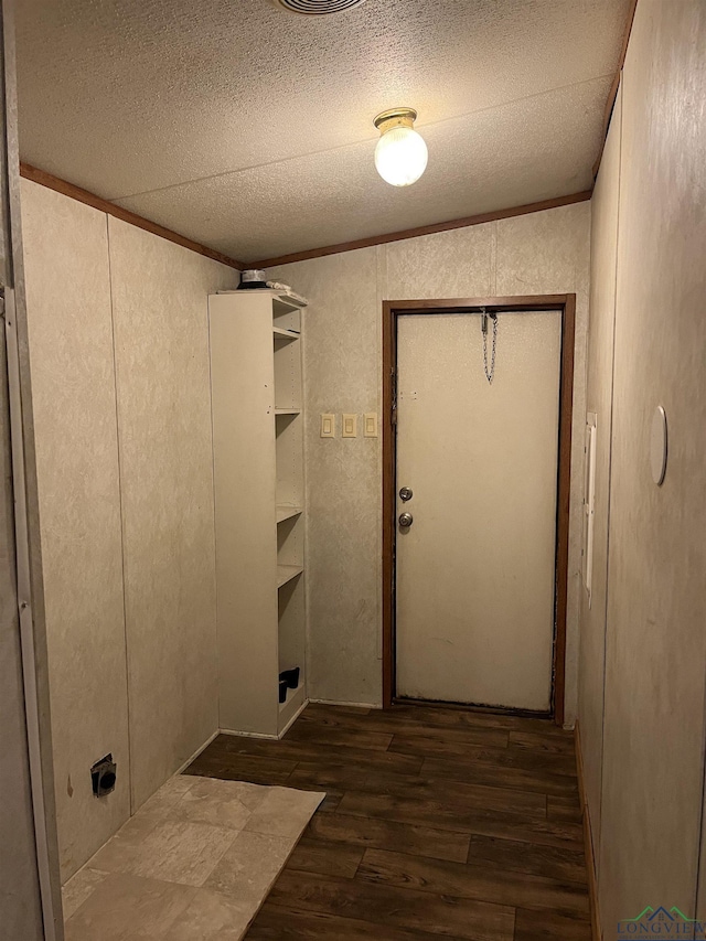 washroom with dark hardwood / wood-style floors and crown molding