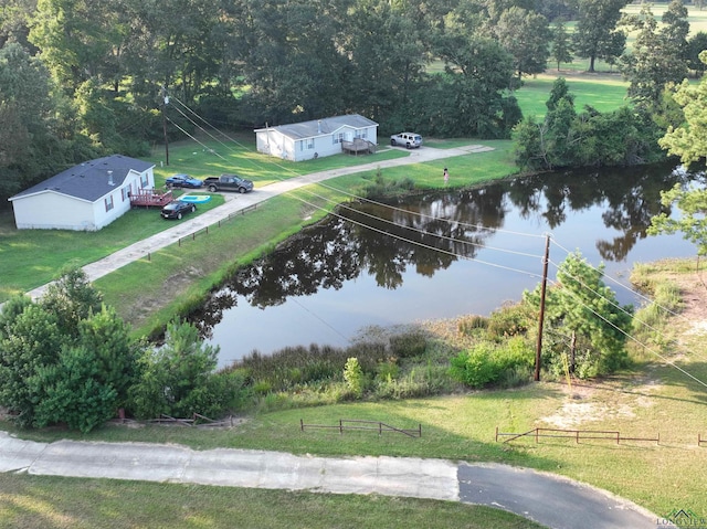 birds eye view of property with a water view