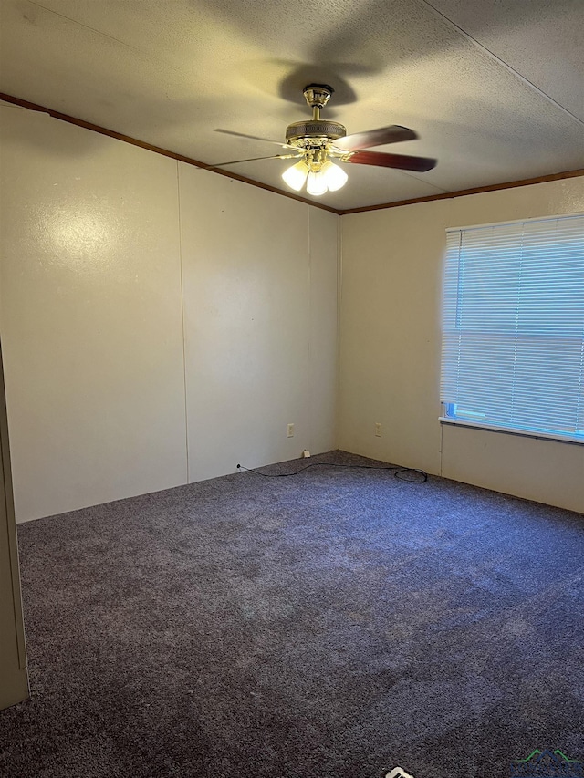 spare room with ceiling fan, carpet, and a textured ceiling