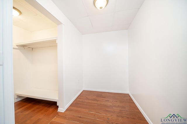 spacious closet featuring hardwood / wood-style floors