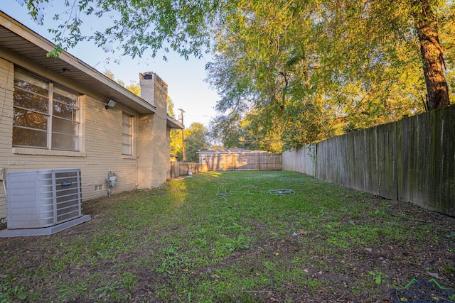 view of yard featuring central air condition unit