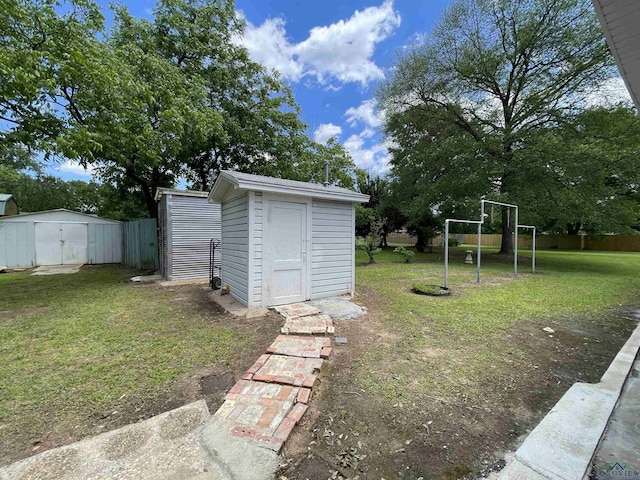 view of yard with a storage shed and an outdoor structure