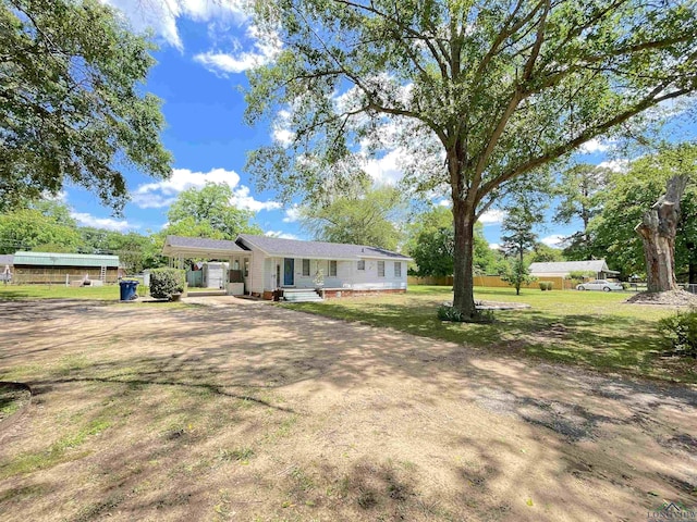 view of front of property with driveway and a front lawn