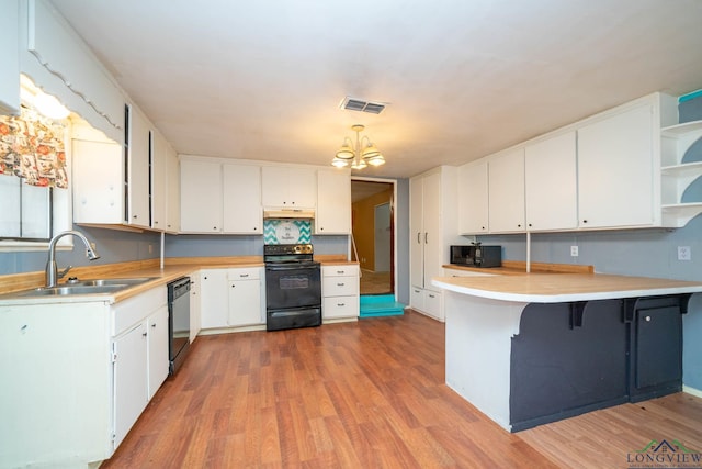 kitchen with visible vents, under cabinet range hood, black appliances, open shelves, and a sink