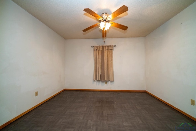 unfurnished room featuring ceiling fan, a textured ceiling, and baseboards