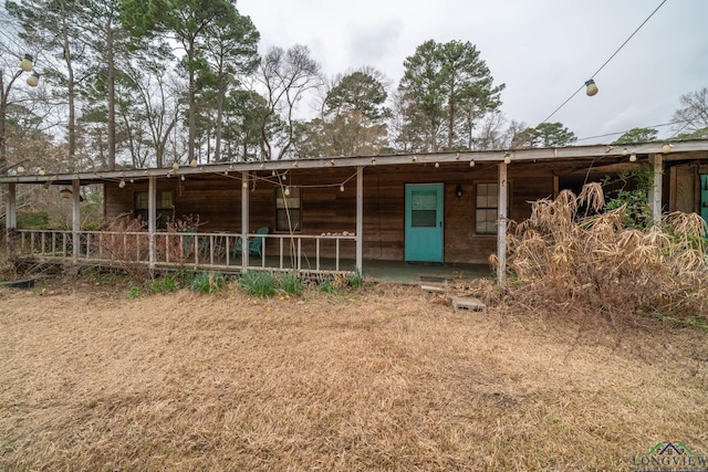 view of front facade featuring an exterior structure and an outbuilding