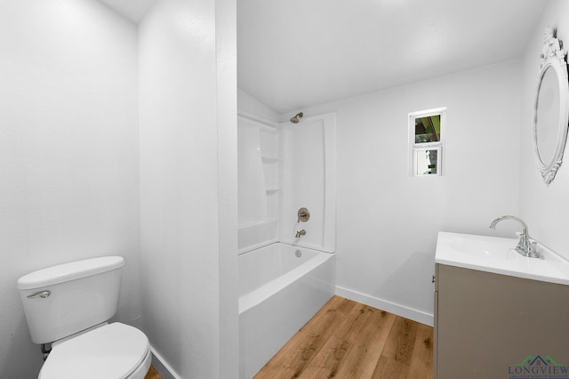 913 Church St, Winnsboro, TX 75494 - bathroom with wood finished floors, vanity, toilet, baseboards, and shower / bath combination