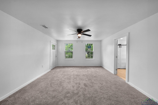 913 Church St, Winnsboro, TX 75494 - empty room featuring carpet, ceiling fan, and baseboards