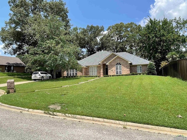 ranch-style home with a front yard