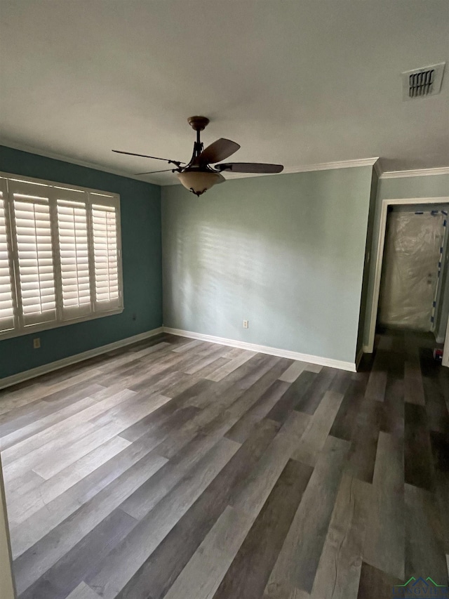 unfurnished room with hardwood / wood-style floors, ceiling fan, and crown molding