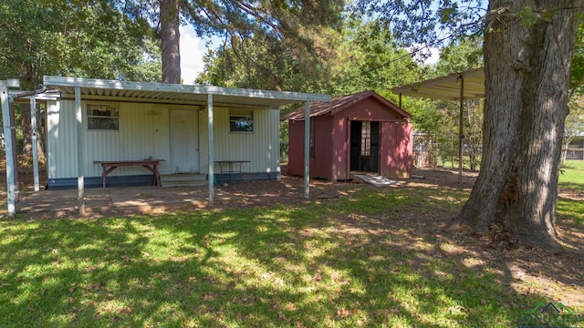 back of house featuring a lawn and a storage shed